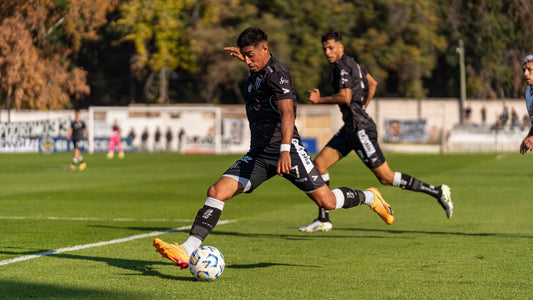Soccer player striking a ball_Stockup Coffee